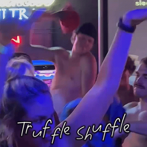 A Group Of People Are Dancing In A Dark Room And The Words Truffle Shuffle Are Written On The Bottom GIF