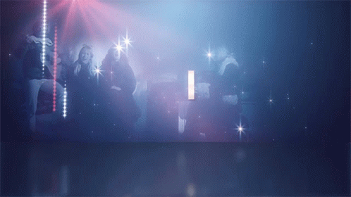 A Group Of People Are Dancing In A Dark Room With The Letter I In The Background GIF
