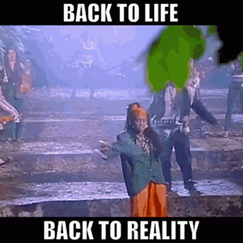 A Group Of People Are Dancing In A Dark Room With The Words Back To Life Back To Reality . GIF