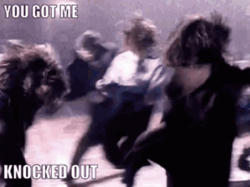 A Group Of People Are Dancing In A Dark Room With The Words `` You Got Me Knocked Out '' . GIF