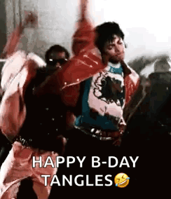 A Group Of People Are Dancing In A Room And A Man Is Holding His Arms In The Air . GIF