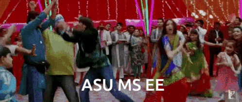 a group of people are dancing in a room with a sign that says asu ms ee