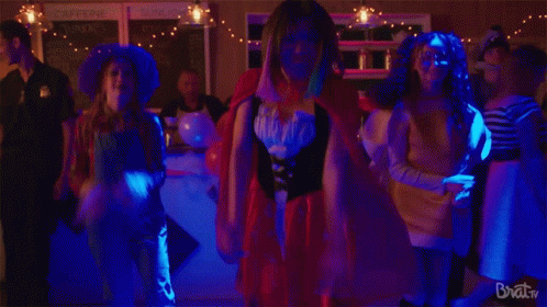 A Group Of People Are Dancing In A Room With The Words Brat Tv On The Bottom Right GIF