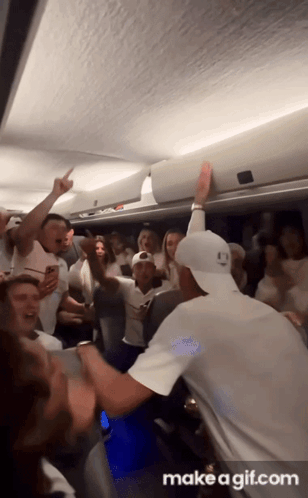A Group Of People Are Dancing In A Room With The Words Make A Gif.com At The Bottom Of The Screen GIF