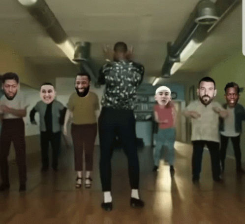 A Group Of People Are Dancing In A Room With Their Faces On Them GIF
