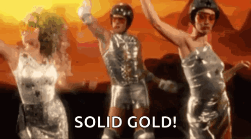 A Group Of People Are Dancing In A Video With The Words Solid Gold . GIF