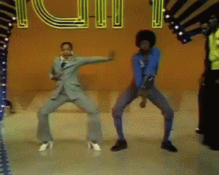 A Group Of People Are Dancing In Front Of A Neon Sign That Says Youth GIF