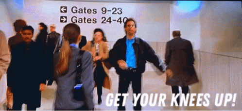 A Group Of People Are Dancing In Front Of A Sign That Says Gates 9-23 GIF
