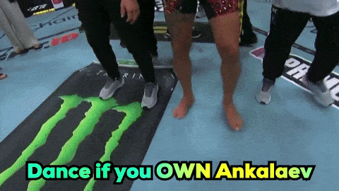 A Group Of People Are Dancing On A Monster Mat GIF