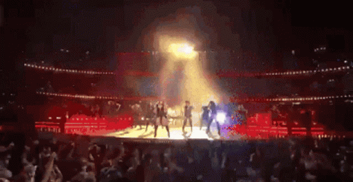 Group Dancing On Stage In Front Of Crowd GIF