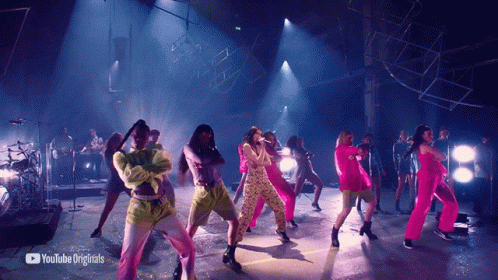A Group Of People Are Dancing On A Stage With Youtube Originals In The Corner GIF