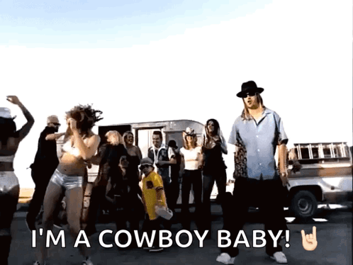 A Group Of People Are Dancing With The Words I 'M A Cowboy Baby Written Below Them GIF