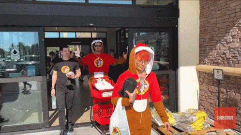 A Group Of People Are Entering A Store With A Sign That Says Subscribe On It GIF