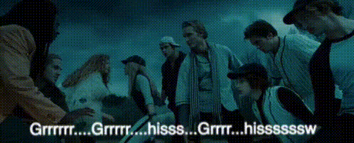 A Group Of People Are Gathered In A Dark Room With The Words " Grrr " Written On The Bottom GIF