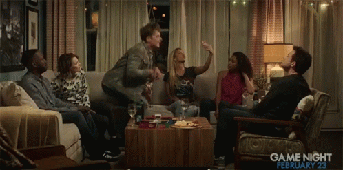 A Group Of People Are Gathered In A Living Room With The Date February 23 GIF