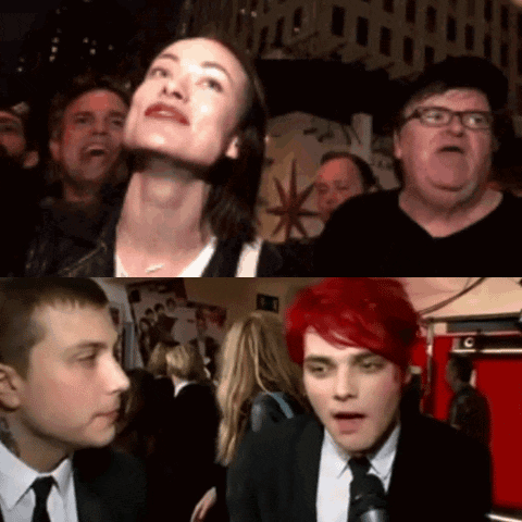 A Group Of People Are Gathered In A Room With A Sign That Says C On It GIF