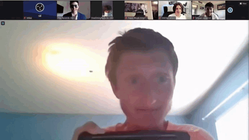 A Group Of People Are Having A Video Call And One Of Them Has A Smiley Face On His Face GIF