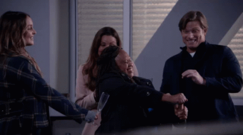 Group Hug With One Holding Glass GIF