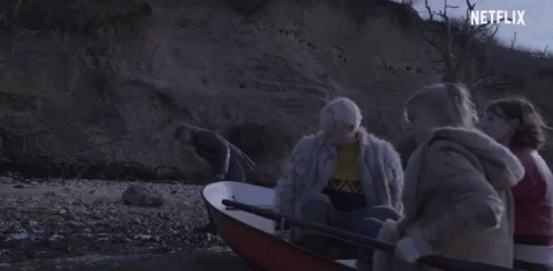 A Group Of People Are In A Boat With A Netflix Logo In The Corner . GIF