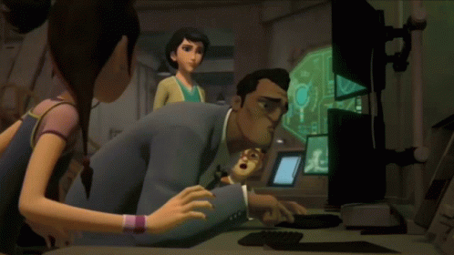 A Group Of People Are Looking At A Computer Screen With A Key On It GIF
