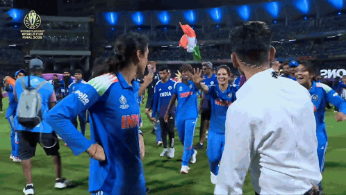 A Group Of People Are On A Field And One Of Their Shirts Has The Word India On It GIF