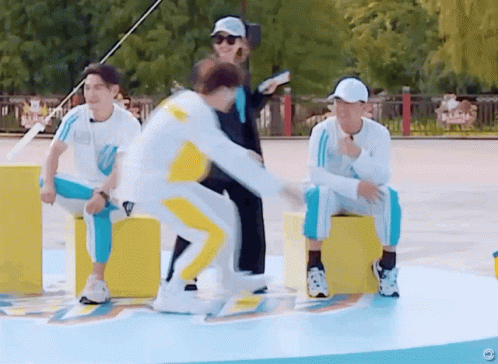 A Group Of People Are Playing A Game And One Of Them Is Jumping GIF
