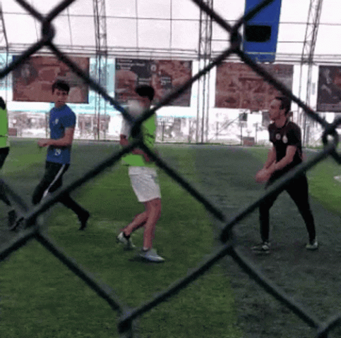 A Group Of People Are Playing A Game Of Soccer GIF