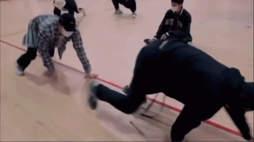 A Group Of People Are Playing A Game On A Basketball Court And One Of Them Is Wearing A Mask That Says Nfc GIF