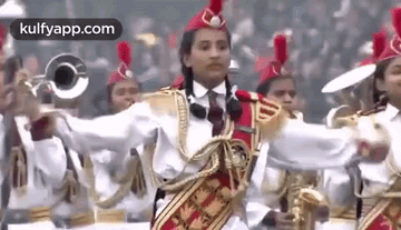 A Group Of People Are Playing Instruments In A Band . GIF