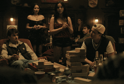 A Group Of People Are Playing Jenga In A Dark Room And One Of Them Is Saying I 'M Just Joking GIF