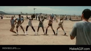 A Group Of People Are Playing Volleyball On A Dirt Field While A Man Watches . GIF