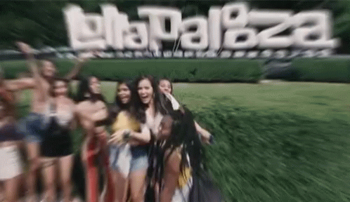 A Group Of People Are Posing For A Picture In Front Of A Sign That Says ' La Palaza ' GIF