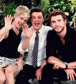 A Group Of People Are Posing For A Picture Together . GIF