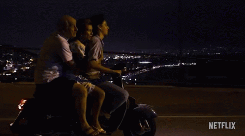 A Group Of People Are Riding A Scooter With The Words " Do N't Worry Mom " Written On The Bottom GIF