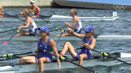 A Group Of People Are Rowing A Boat With The Number 8 On The Back GIF