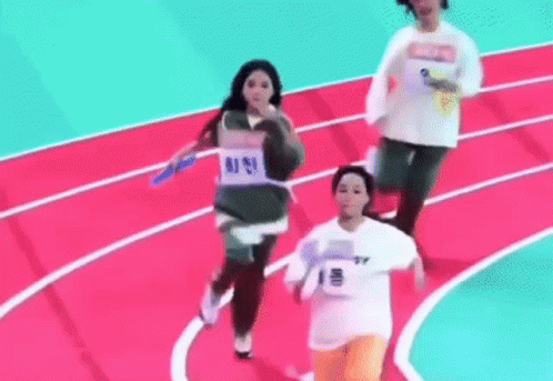 A Group Of People Are Running On A Track And One Of Them Is Wearing A Number 1 Shirt . GIF