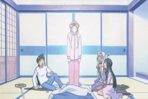 A Group Of People Are Sitting Around A Bed With A Ghost In The Background GIF