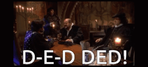 A Group Of People Are Sitting Around A Table With The Words D-E-D Ded GIF