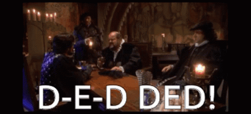 A Group Of People Are Sitting Around A Table With The Words D-E-D Ded GIF
