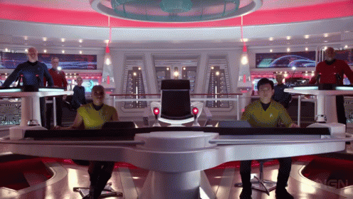 A Group Of People Are Sitting At A Table With The Word Ign On The Bottom Right GIF