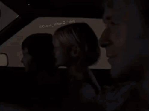 A Group Of People Are Sitting In A Car . GIF