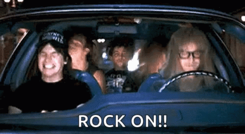 A Group Of People Are Sitting In A Car With The Words `` Rock On '' Written On It . GIF