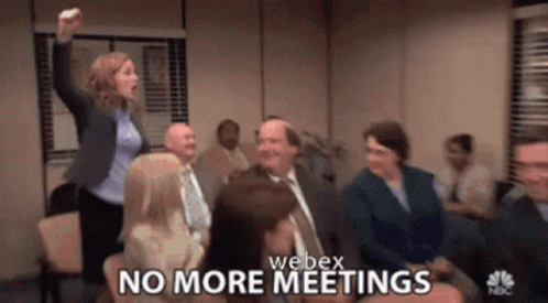 A Group Of People Are Sitting In A Room With The Words No More Meetings GIF