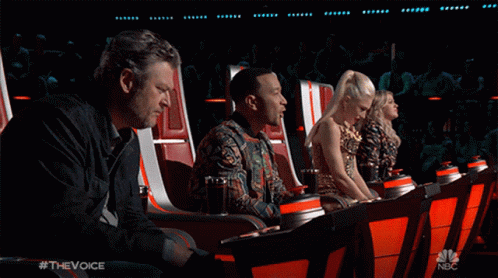 A Group Of People Are Sitting In A Theatre With A Nbc Logo In The Corner GIF