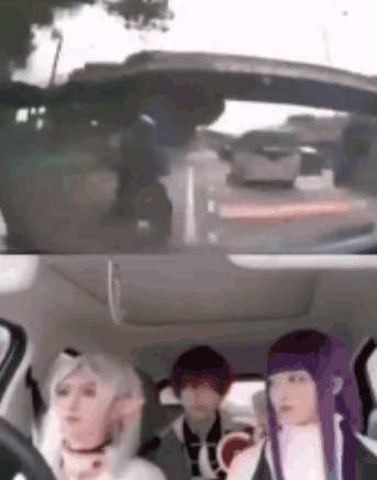 A Group Of People Are Sitting In The Back Seat Of A Car Looking Out The Window . GIF