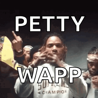A Group Of People Are Standing Around A Man Holding A Microphone And A Sign That Says Petty Wapp . GIF