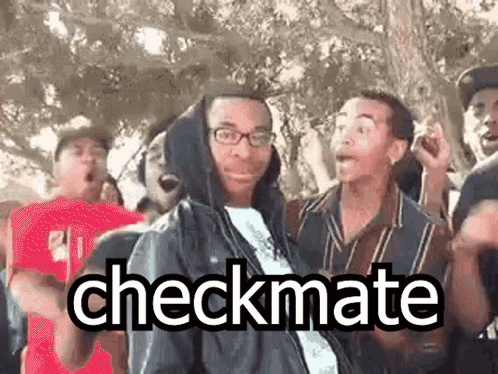 A Group Of People Are Standing Around A Man In A Hooded Jacket . GIF