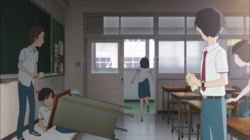 A Group Of People Are Standing In A Classroom With A Blackboard That Says ' I 'M Sorry ' On It GIF