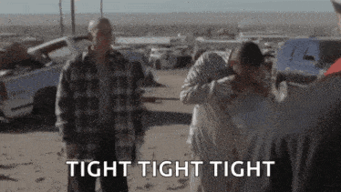 A Group Of People Are Standing In A Field With The Words Tight Tight Tight Written On The Bottom . GIF
