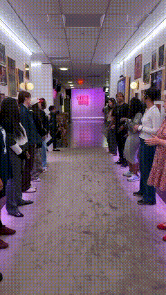 A Group Of People Are Standing In A Hallway In Front Of A Sign That Says ' Sleep ' GIF